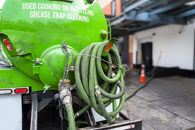 pumping out a heavy-duty grease trap at a restaurant in Watford City